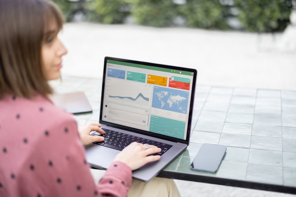 Reviewing campaign performance dashboards on a laptop